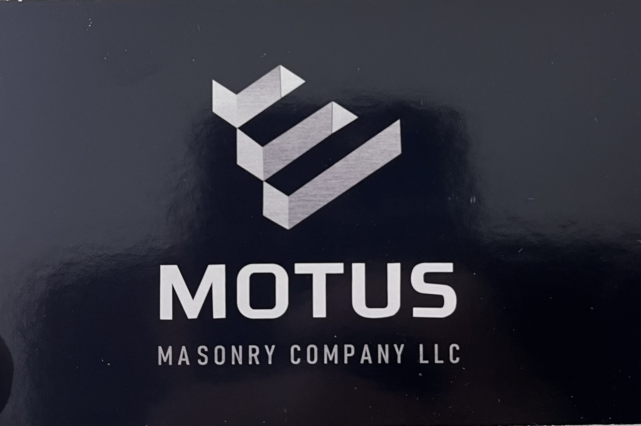 Motus Masonry Company LLC Logo