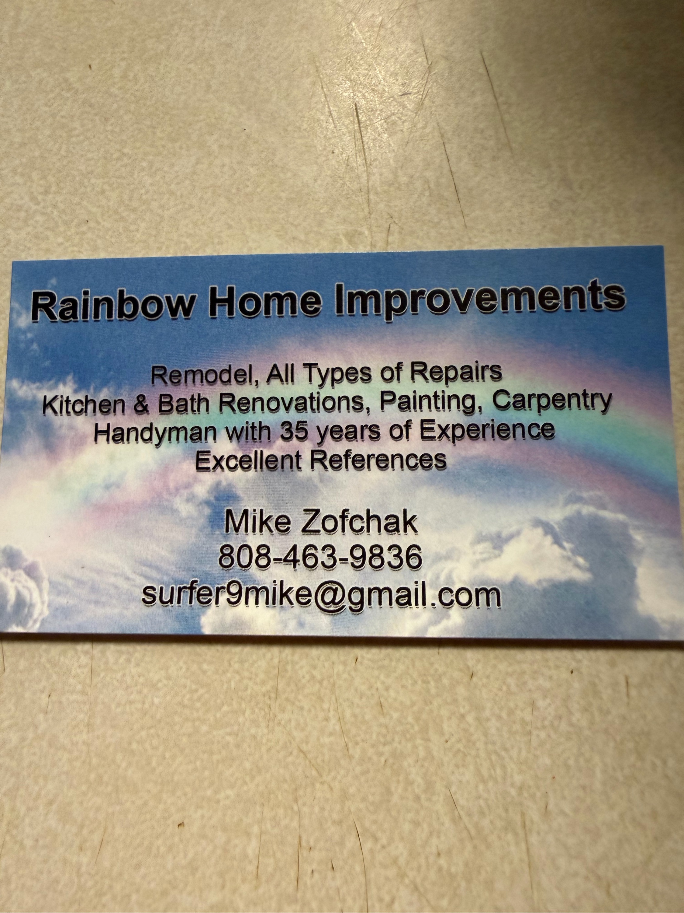 Rainbow Home Improvements Logo
