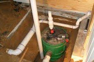 How do you use a pump to remove water from a basement?