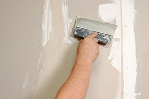 fix drywall crack with caulk