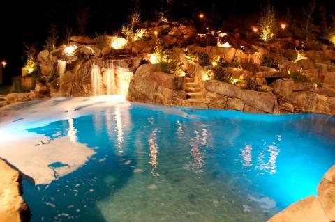 Traditional Pool with large landscape boulders