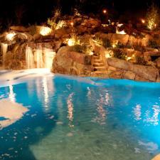 Traditional Pool with large landscape boulders