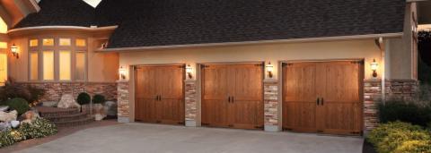 Rustic Garage with barn door style garage door