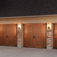 Rustic Garage with barn door style garage door