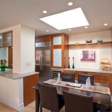 Contemporary Dining Room with dark brown leather furniture