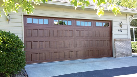 Transitional Garage with brick and hardie plank siding