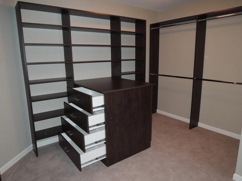 Traditional Closet with beige carpet flooring