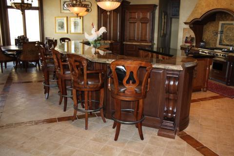 Traditional Kitchen with granite back splash over stove
