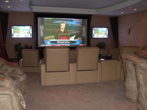 Traditional Home Theater with carmel leather theater chairs