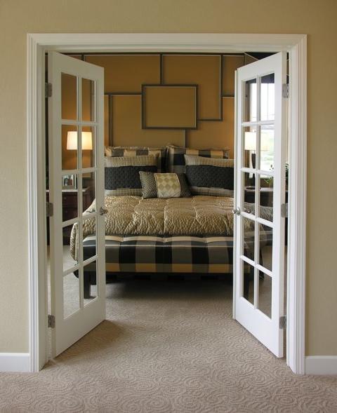 Contemporary Bedroom with black yellow and gray plaid bed foot ottoman