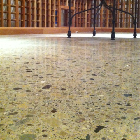 Contemporary Wine Cellar with acid-stained concrete acid-stained concrete flooring