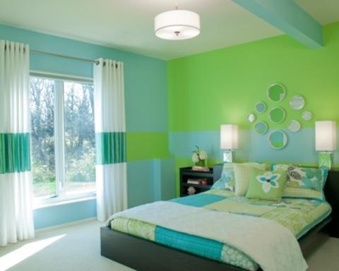 Transitional Bedroom with round decorative mirrors