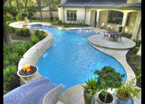 Eclectic Pool with vines grown up trellis on side of home