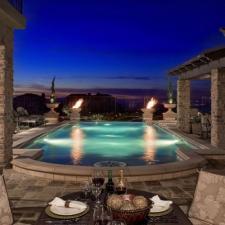 Traditional Pool with wood trellis over part of patio