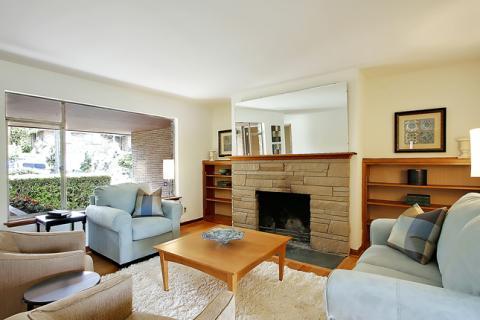 Traditional Living Room with light wood built-in book shelves