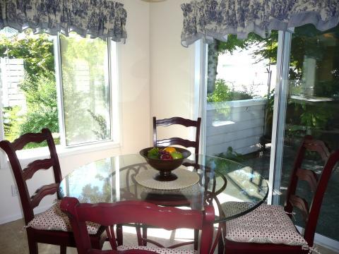 Cottage Dining Room with blue and white ruffled valances