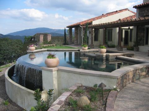 Traditional Pool with dark wood support columns