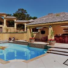 Traditional Pool with tiled floor of the pool of the sun