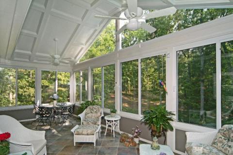Traditional Sunroom with black metal conversational set