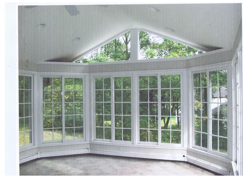 Contemporary Sunroom with electric baseboard heat