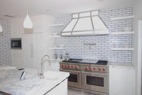 Eclectic Kitchen with white subway tile accent walls