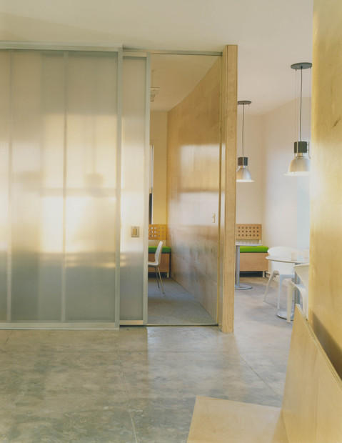 Contemporary Home Office with sliding frosted glass office dividers