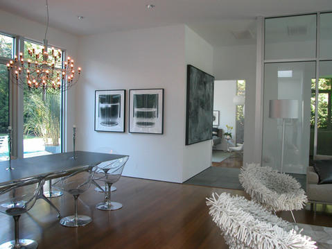 Modern Dining Room with clear plastic eames dining chairs