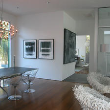 Modern Dining Room with clear plastic eames dining chairs