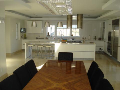 Modern Dining Room with large silver hanging ceiling lights
