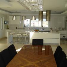 Modern Dining Room with large silver hanging ceiling lights