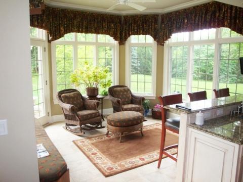 Traditional Sunroom with dark brown granite counter top