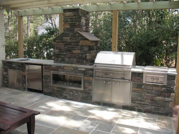 Traditional Outdoor Kitchen with stainless steel appliances