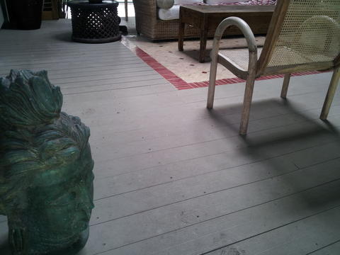 Rustic Sunroom with rustic coffee table
