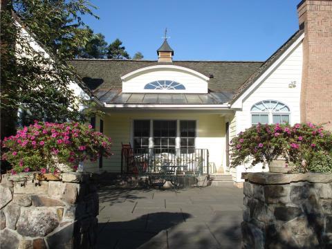 Traditional Patio with wrought iron railing