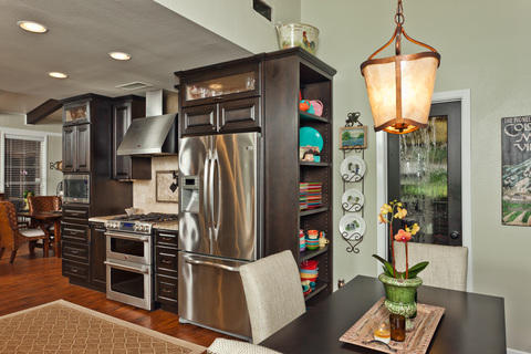 Eclectic Kitchen with high end stainless steel refrigerator