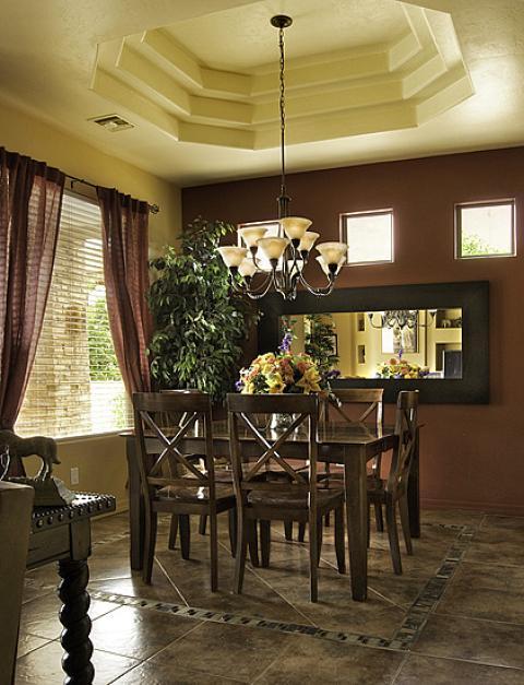 Traditional Dining Room with nail head detail on table