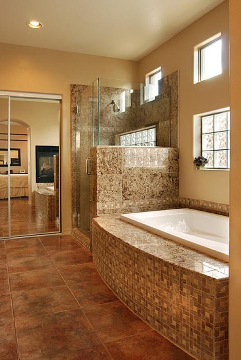 Transitional Bathroom with brown granite tile shower wall covering