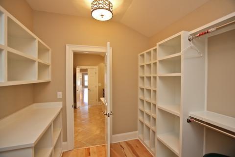 Transitional Closet with metal glass surface mounted lighting