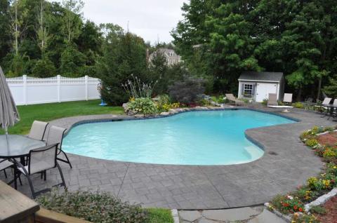 Traditional Pool with outdoor dining table and chairs