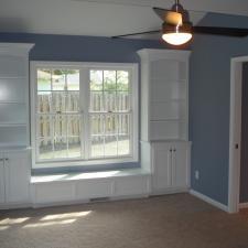 Traditional Bedroom with custom book shelves and window seat