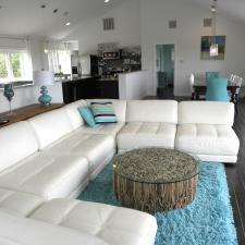 Eclectic Family Room with rustic wood and glass coffee table