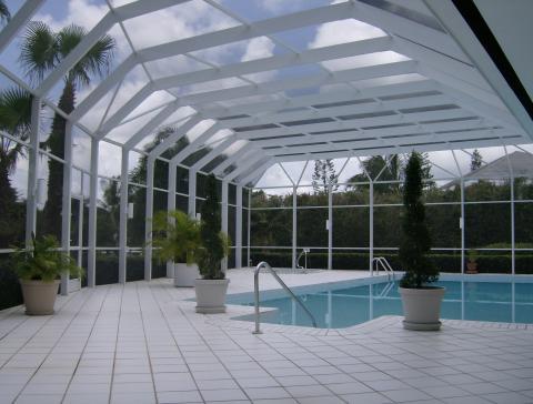 Contemporary Pool with circle in ground hot tub