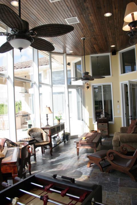 Traditional Sunroom with overstuffed cuddle chair