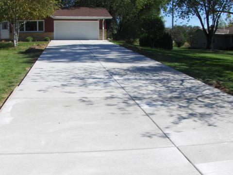 Traditional Driveway with brick and siding home