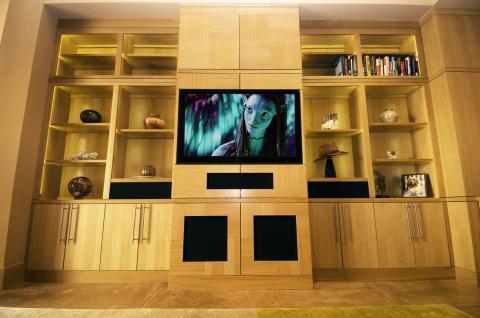 Contemporary Family Room with built-in flat screen tv