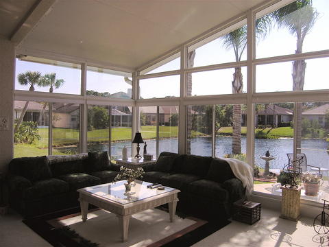 Transitional Sunroom with floor to ceiling window