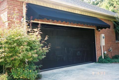 Transitional Garage with black canvas awning at garage