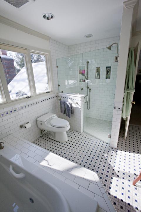 Transitional Bathroom with drop in tub with tile surround