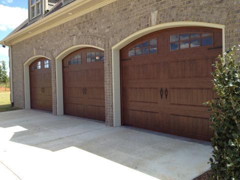 Transitional Garage with garage doors with windows