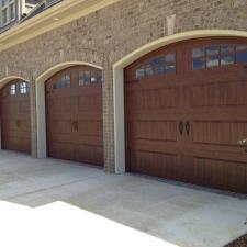 Transitional Garage with garage doors with windows